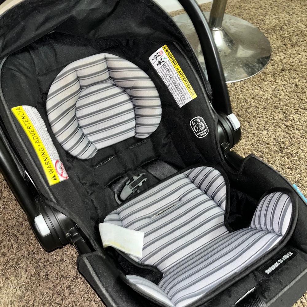 Graco Infant Car Seat with Striped Cushion and stroller